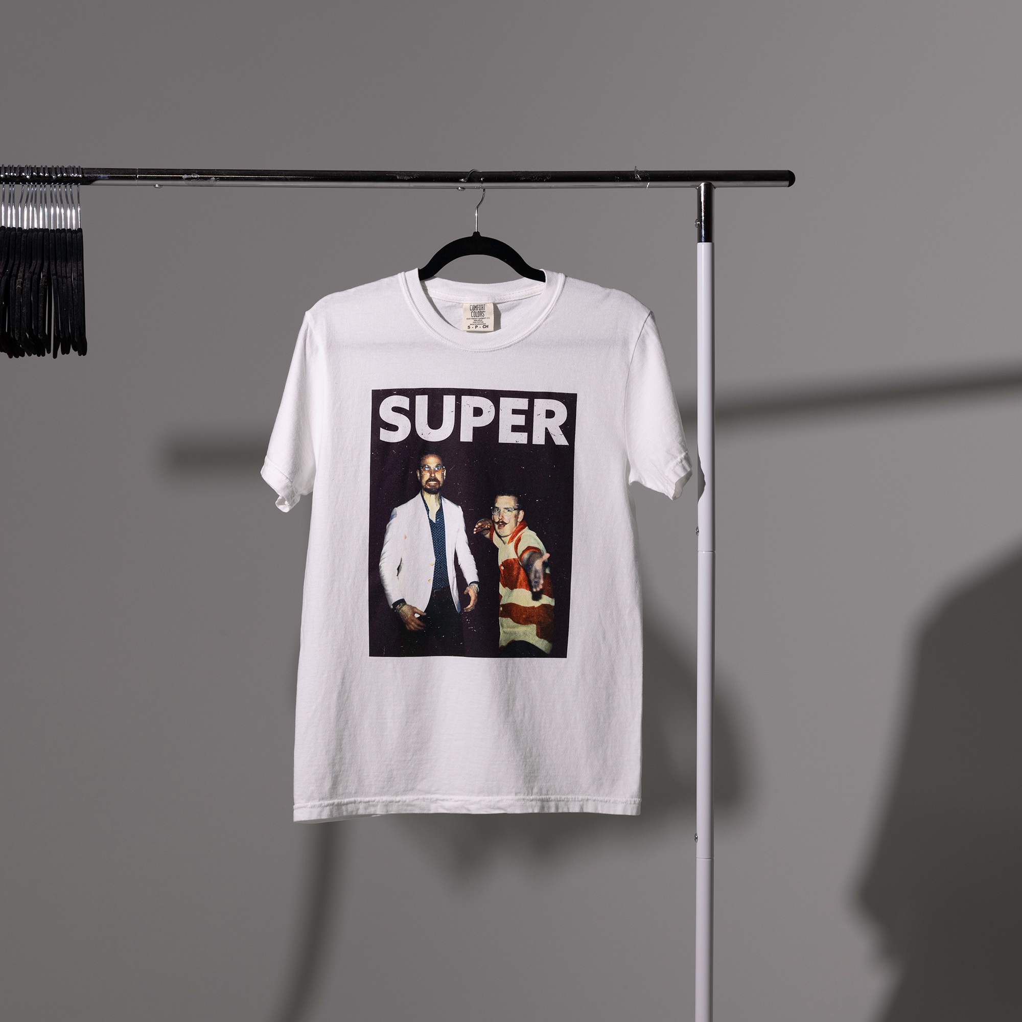 super tshirt carlin brothers white tshirt on shirt rack
