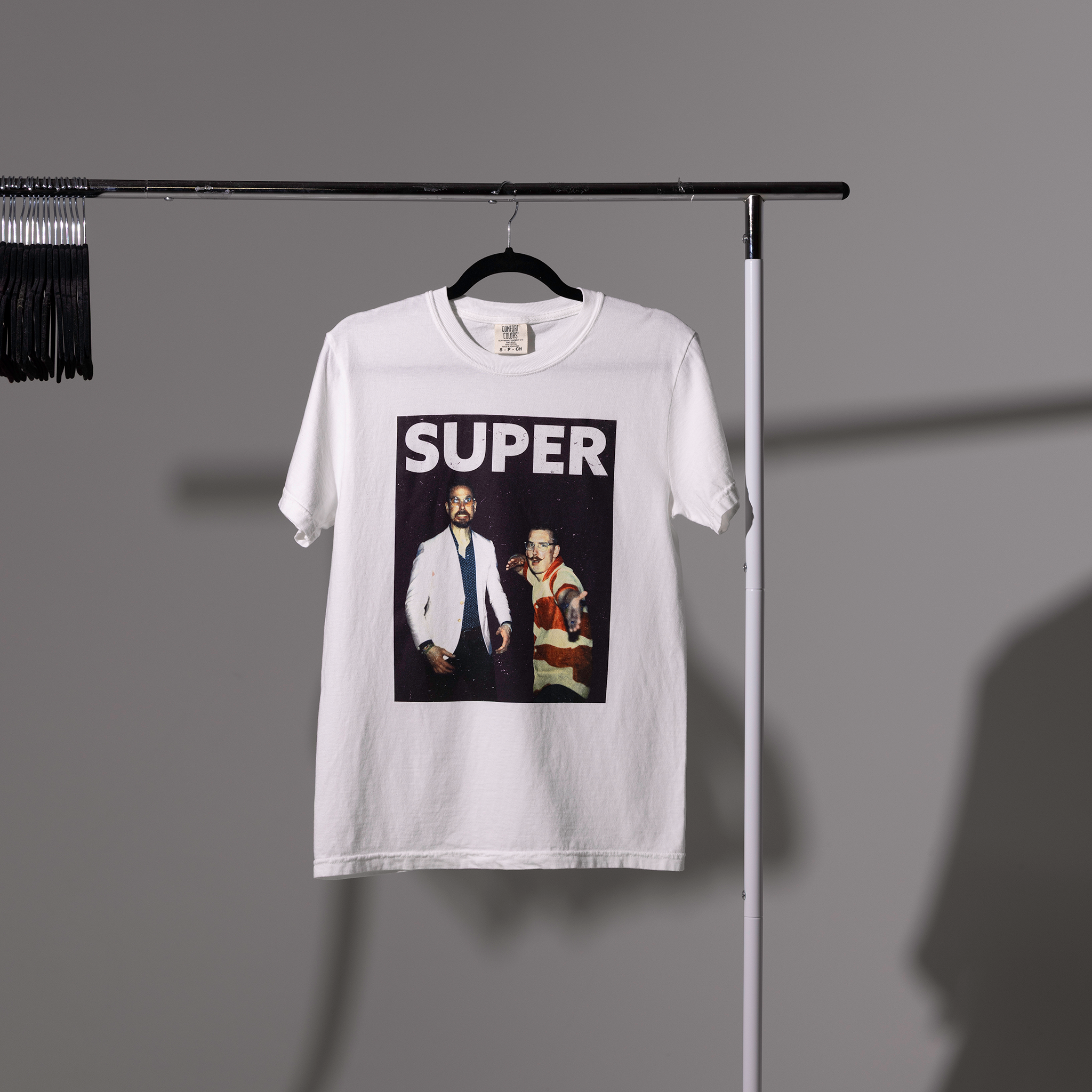 super tshirt carlin brothers white tshirt on shirt rack