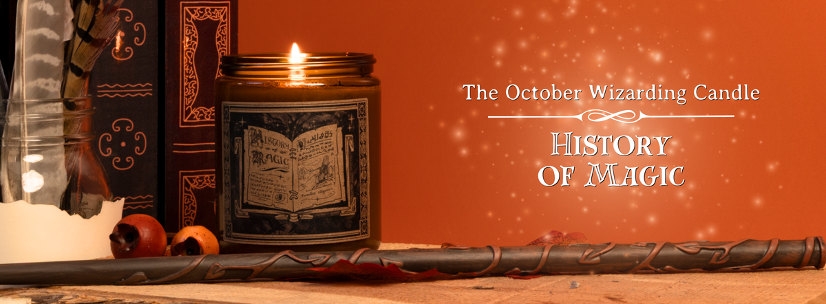 History Of Magic brown glass candle infront of an orange background with fall leaves and a magical wand laid infront.