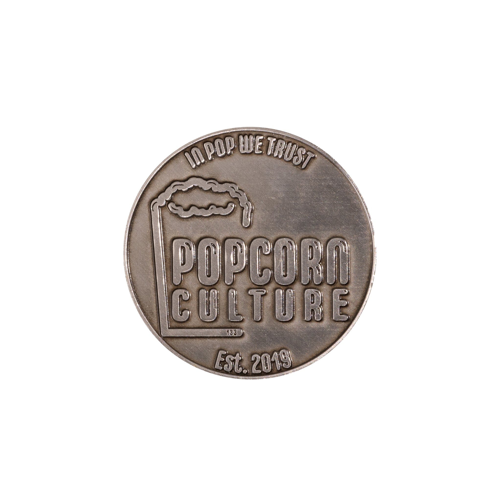 coin that says in pop we trust popcorn culture est.2019